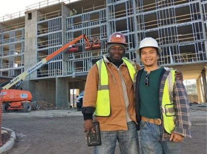 Nana (left) with his associate, Anthony (right), at a job site